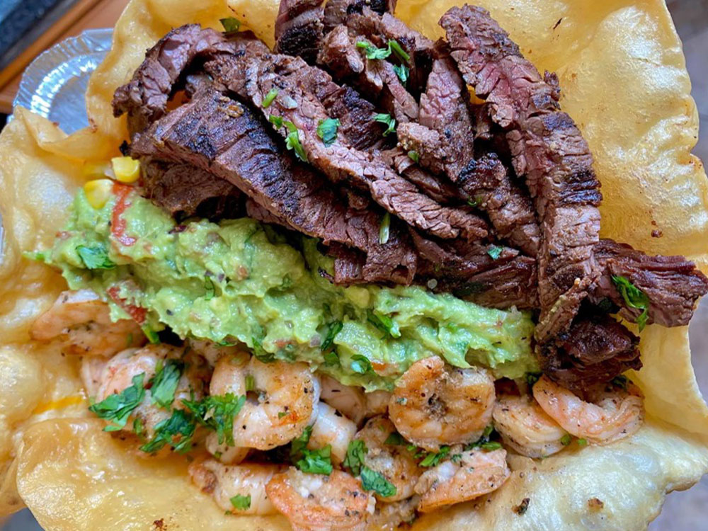 Steak taco with creamy avocado and fresh cilantro