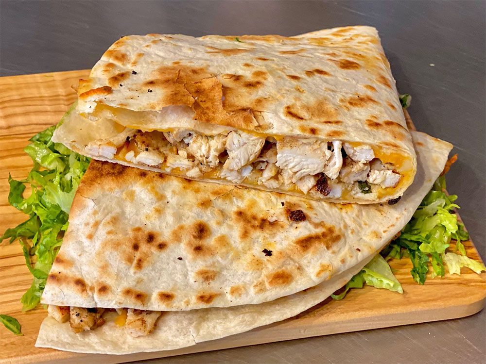 Yolpaqui grilled chicken burrito sliced open
